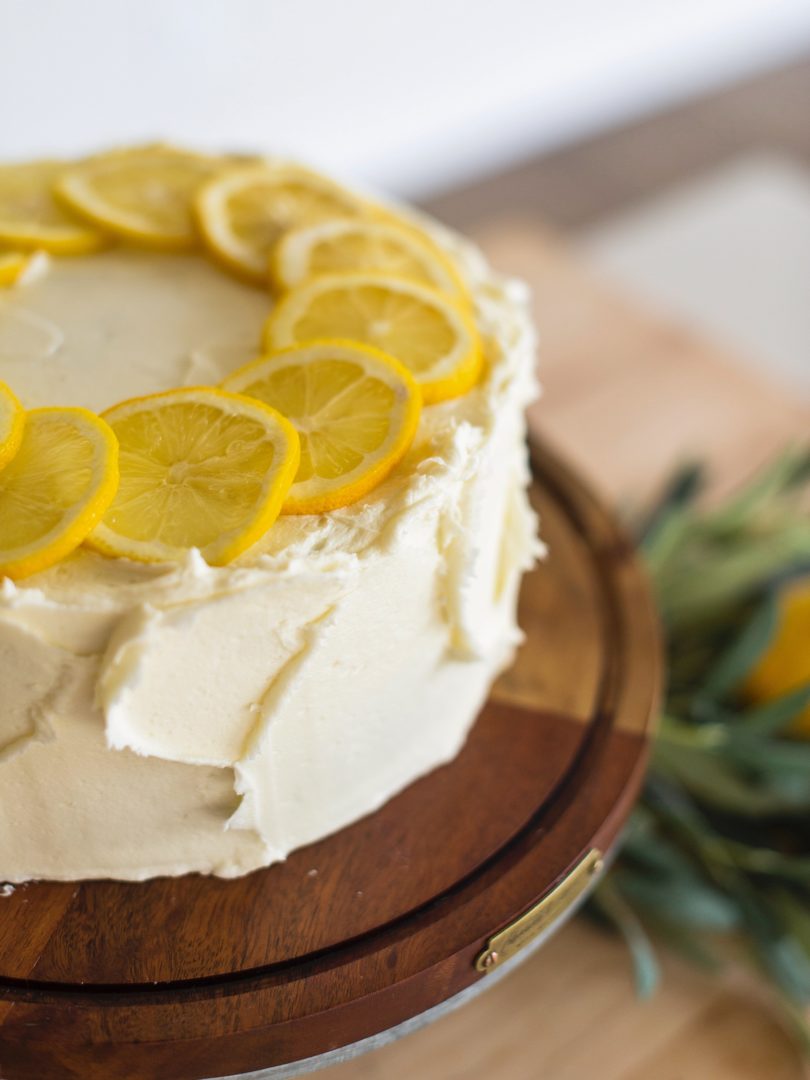 Cake by Courtney - Chocolate Lemon Zucchini Cake #chocolatecake #chocolatezucchinicake #lemoncreamcheesefrosting #chocolatelemonzucchinicake Chocolate Zucchini Cake on a cake stand.