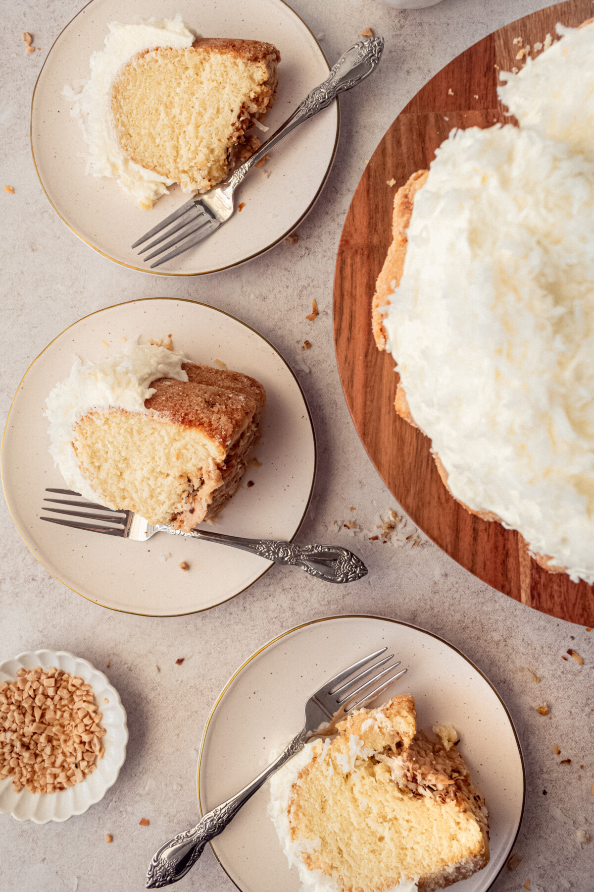 Slices of coconut bundt cake on plates.