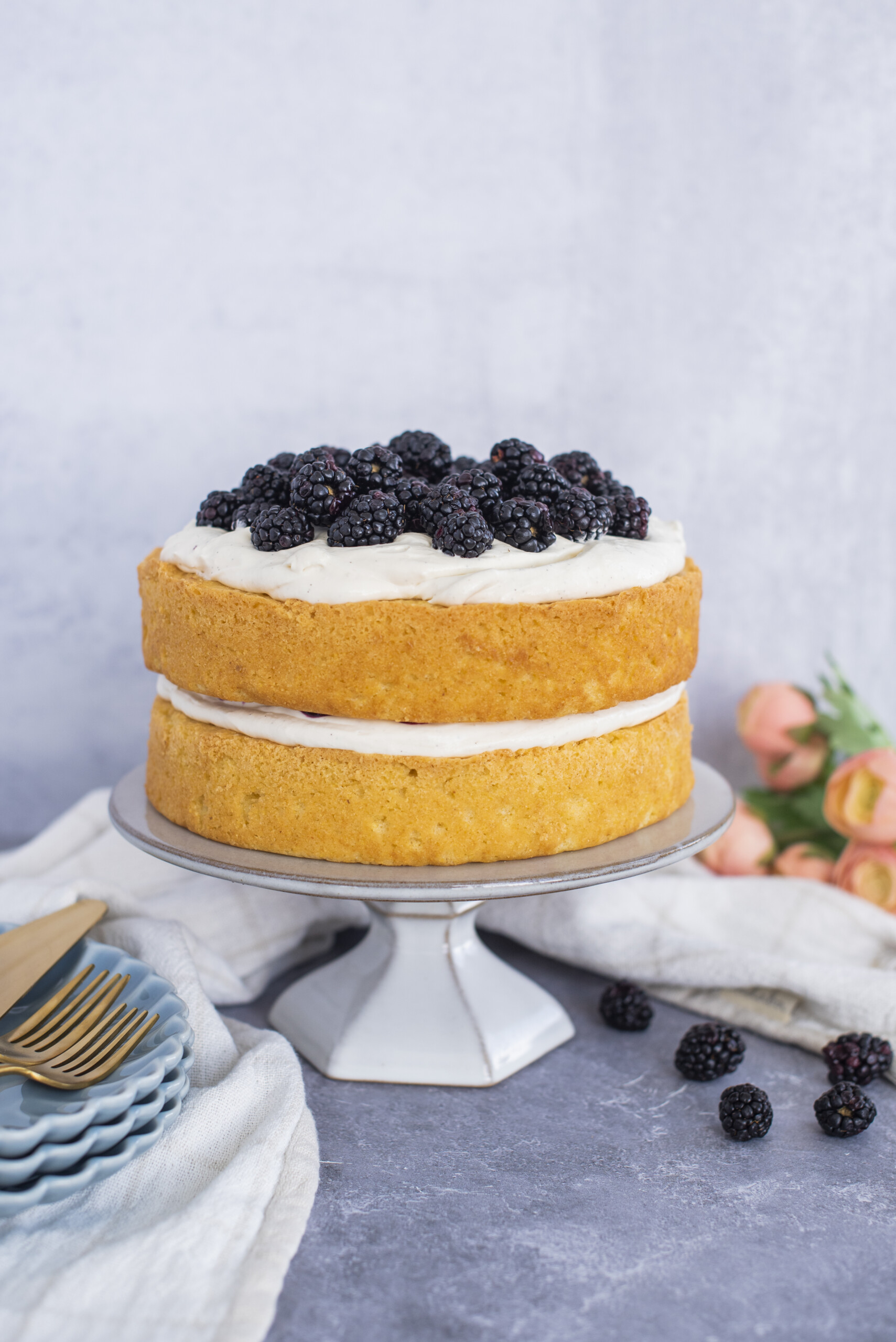 A two layer cake on a cake stand.