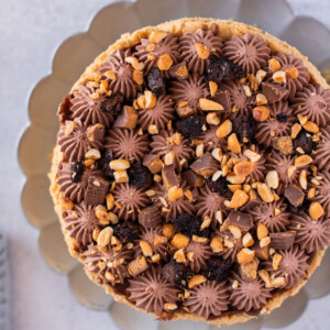 Peanut Butter Brookie Pie on a cake plate.
