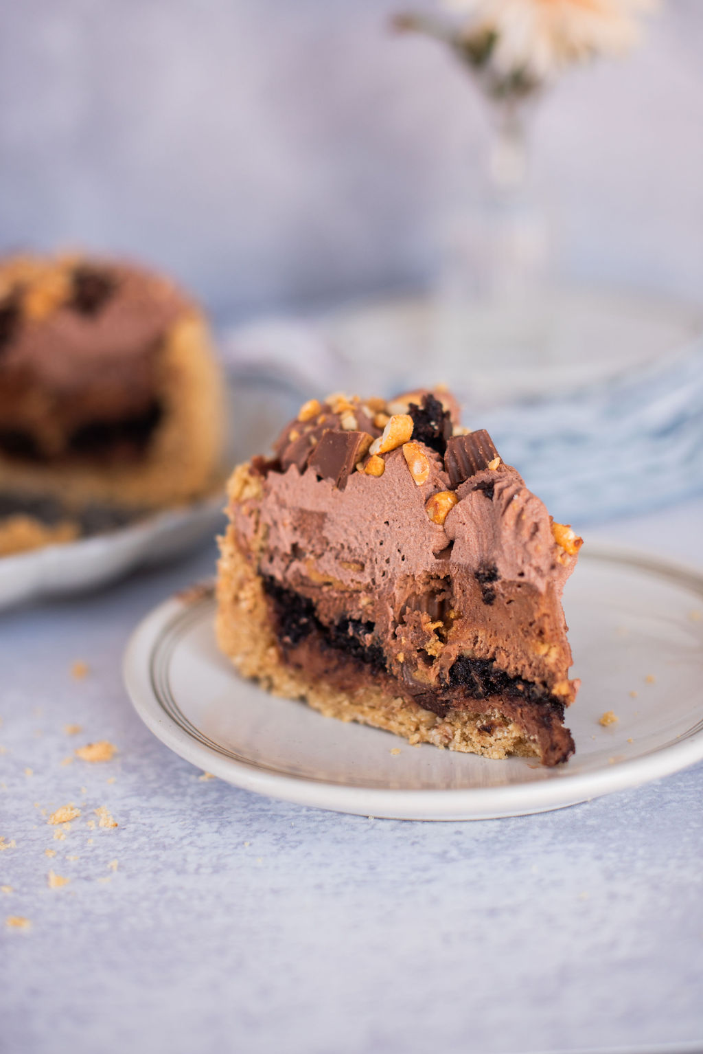 A slice of a peanut butter brookie pie on a plate.