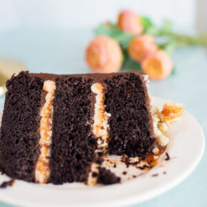 A slice of cake with a bite take out of it.