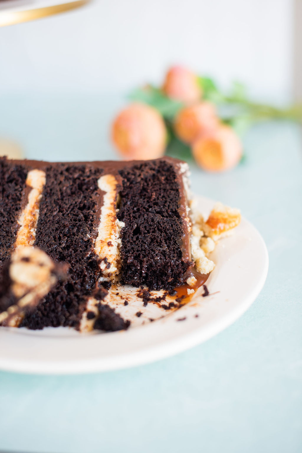 A slice of cake on a plate with a bite taken out of it.