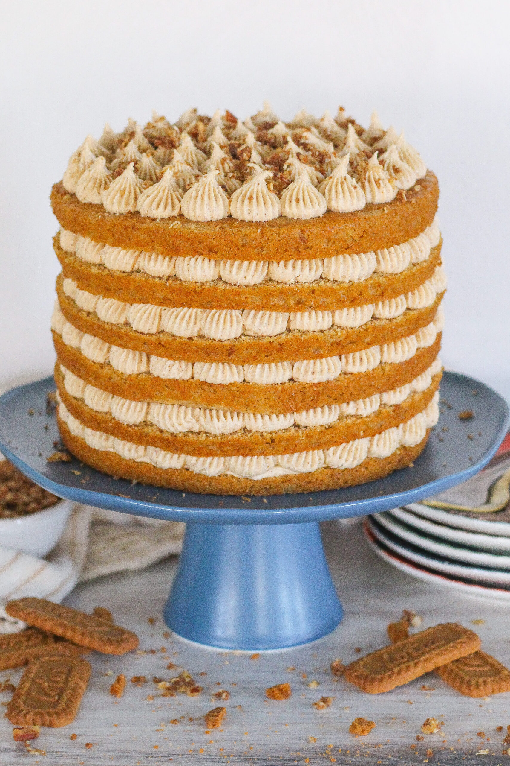 Six layer cake on a cake stand.