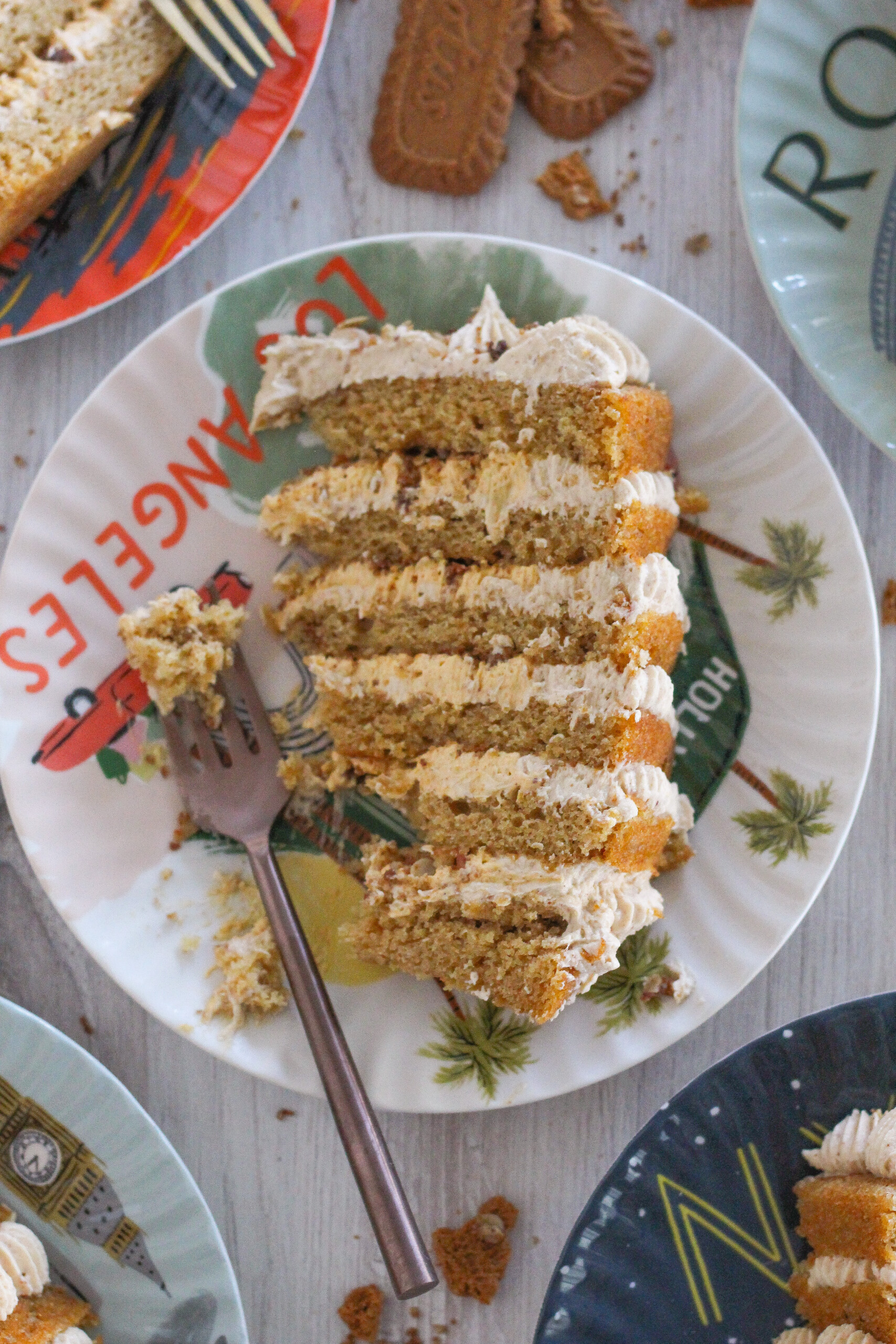 Slice of pumpkin cake on a plate with a fork.