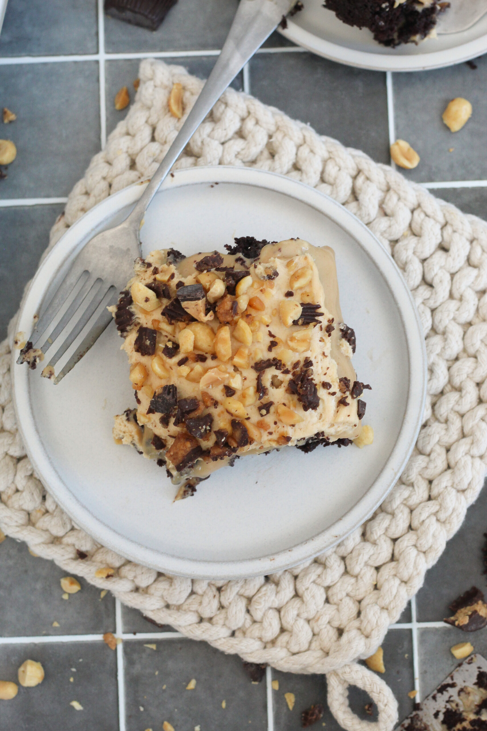 Slice of cake on a plate with a napkin.