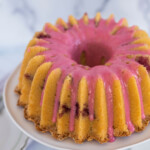 Raspberry Cheese Danish Bundt Cake on a cake stand.